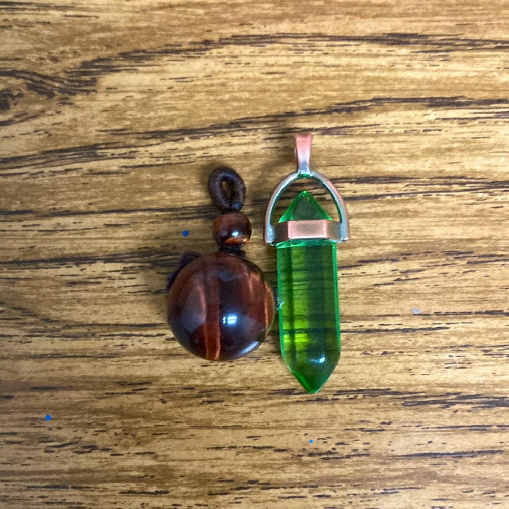 Necklace charms tigers eye and I don't know what the other one is